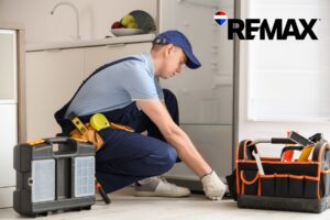 Home repair technician addressing condition issues in an Indianapolis kitchen — deferred maintenance is one of the top reasons listings go stale