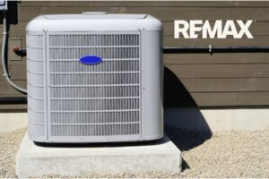 Central air conditioning unit outside an Indiana home for sale, the kind of aging HVAC system sellers weigh before listing