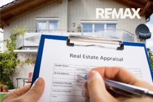 Real estate appraisal form on a clipboard held in front of a home before selling in Indiana