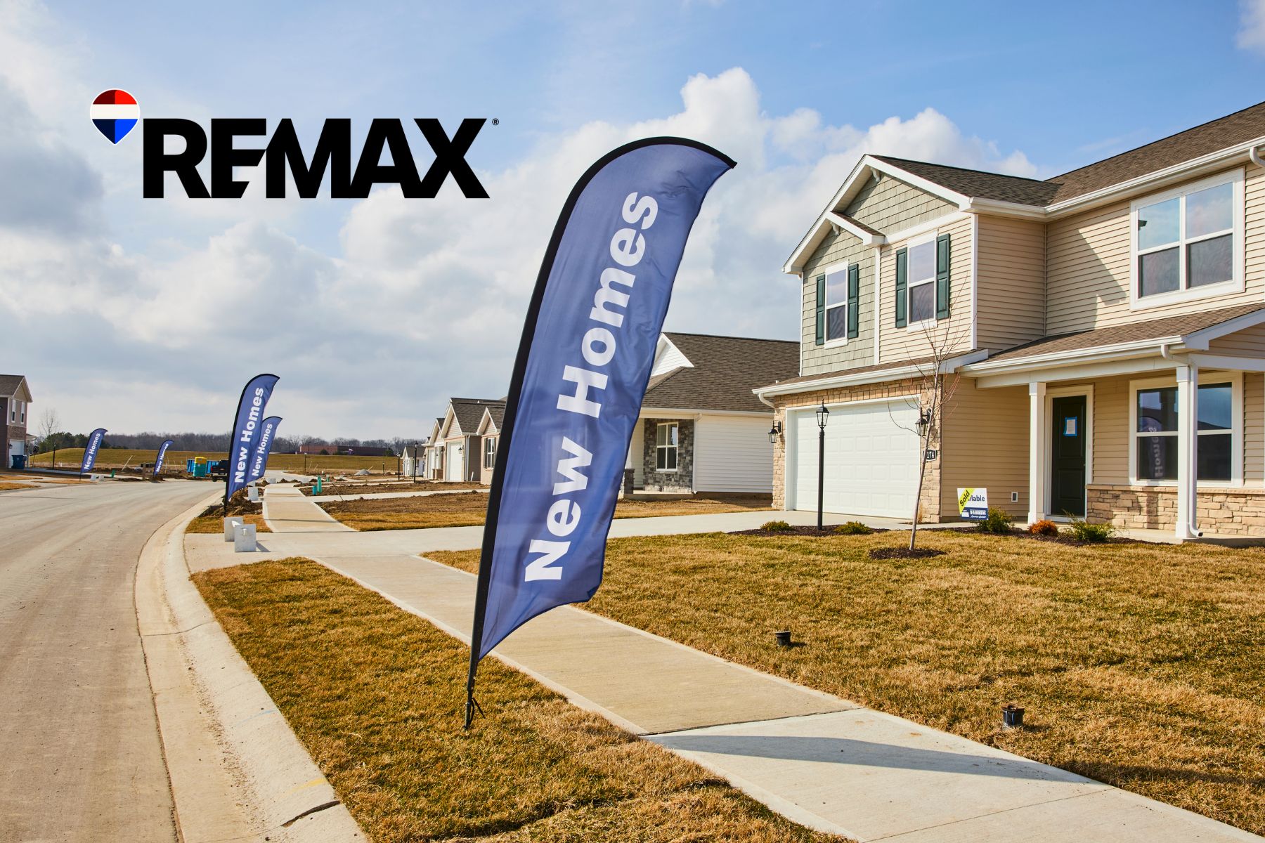 New construction homes with New Homes flags in a Hendricks County, Indiana subdivision, RE/MAX branding